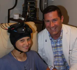 Student Receiving Transcranial and Magnetic Stimulation and Neurofeedback Traning at the NeuroEdge Brain Performance Center Connecticut